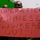 A Kenyan trader holds up a placard during a protest against Chinese hawkers in Nairobi in 2012.